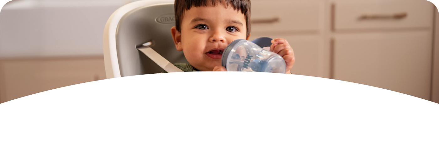 [Translate to French (Reborn):] Baby with NUK Perfect Match Learner bottle straw