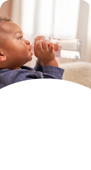 [Translate to French (Reborn):] Baby with Learner bottle