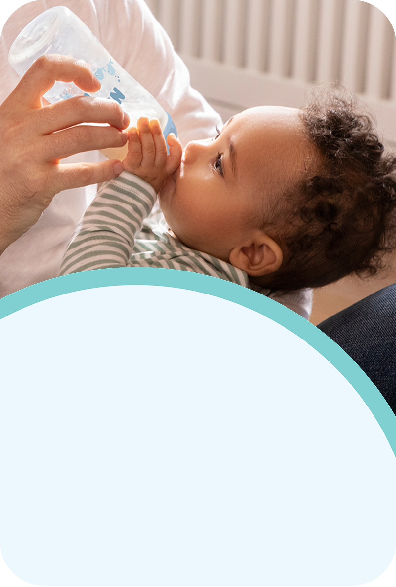 [Translate to French (Reborn):] Baby with Baby bottle