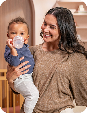 [Translate to French (Reborn):] Mother with Baby and Learner bottle