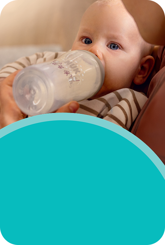 [Translate to French (Reborn):] Baby with Baby bottle