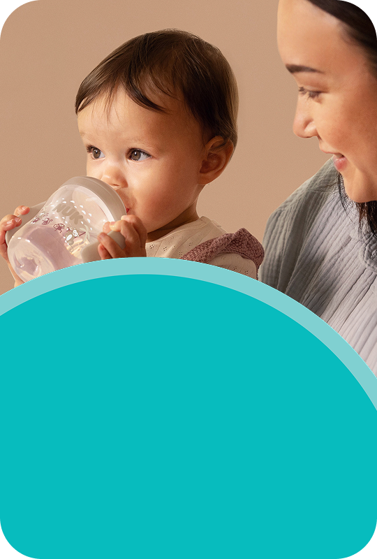 [Translate to French (Reborn):] Mother with Baby and Learner bottle