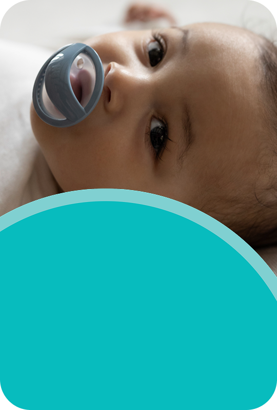 [Translate to French (Reborn):] Baby with soother